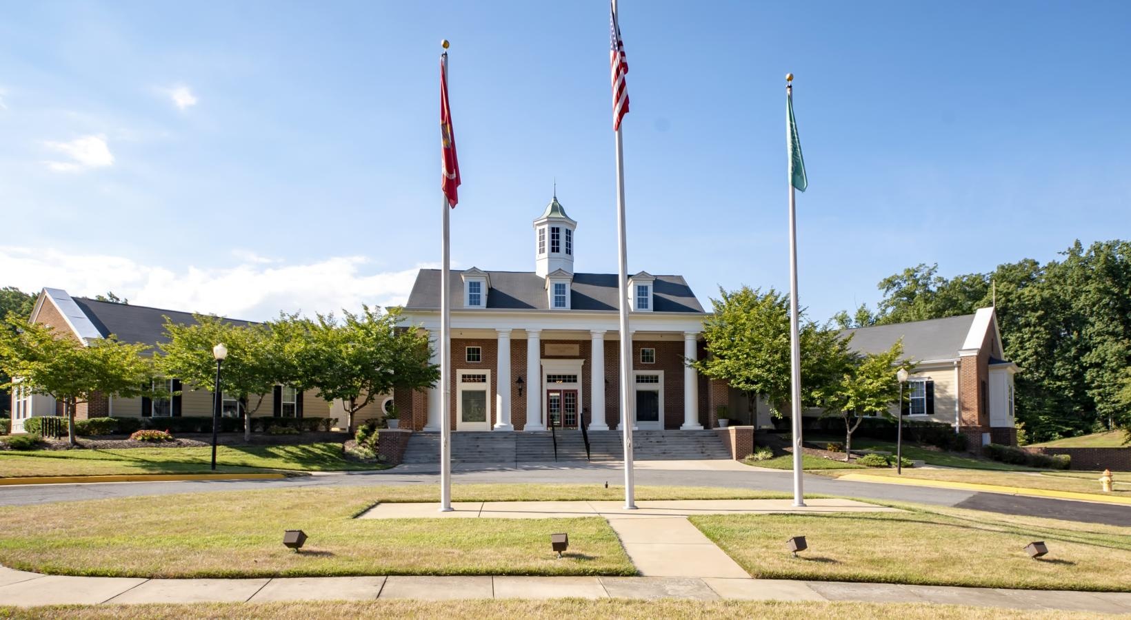 a building with flags in front of it
