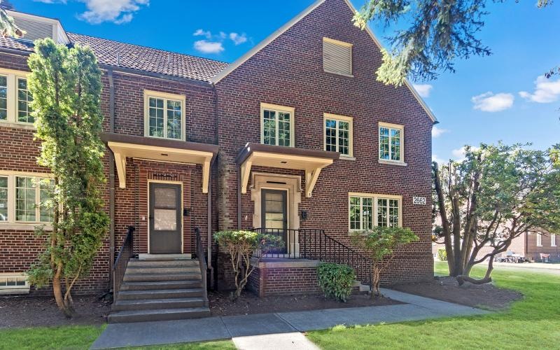a brick house with a front yard