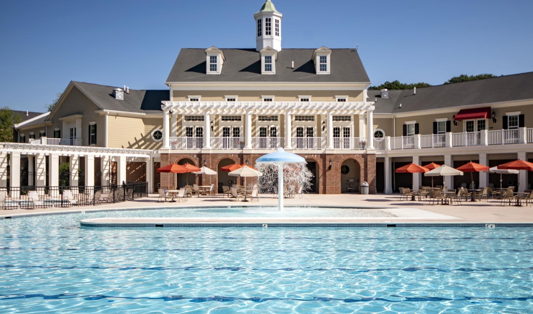 a pool in front of a building