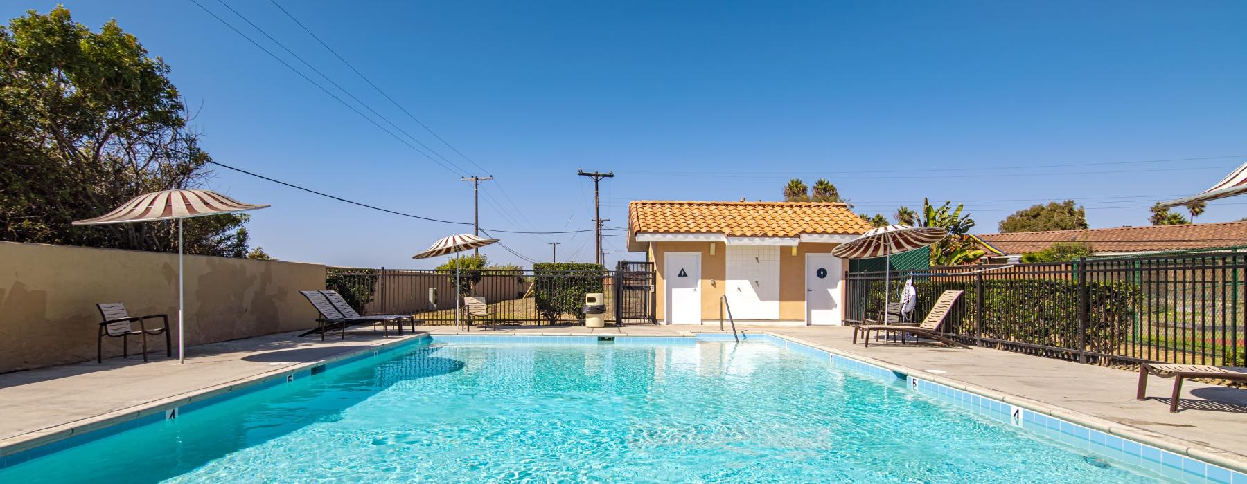 a swimming pool with a fence around it