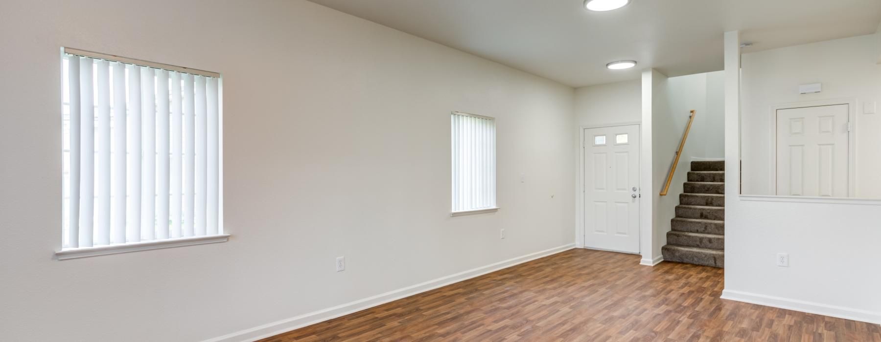 a room with a wood floor and a wood floor with a wood floor