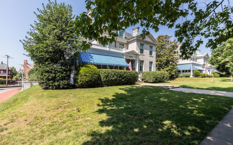 a house with a large front yard and landscaping