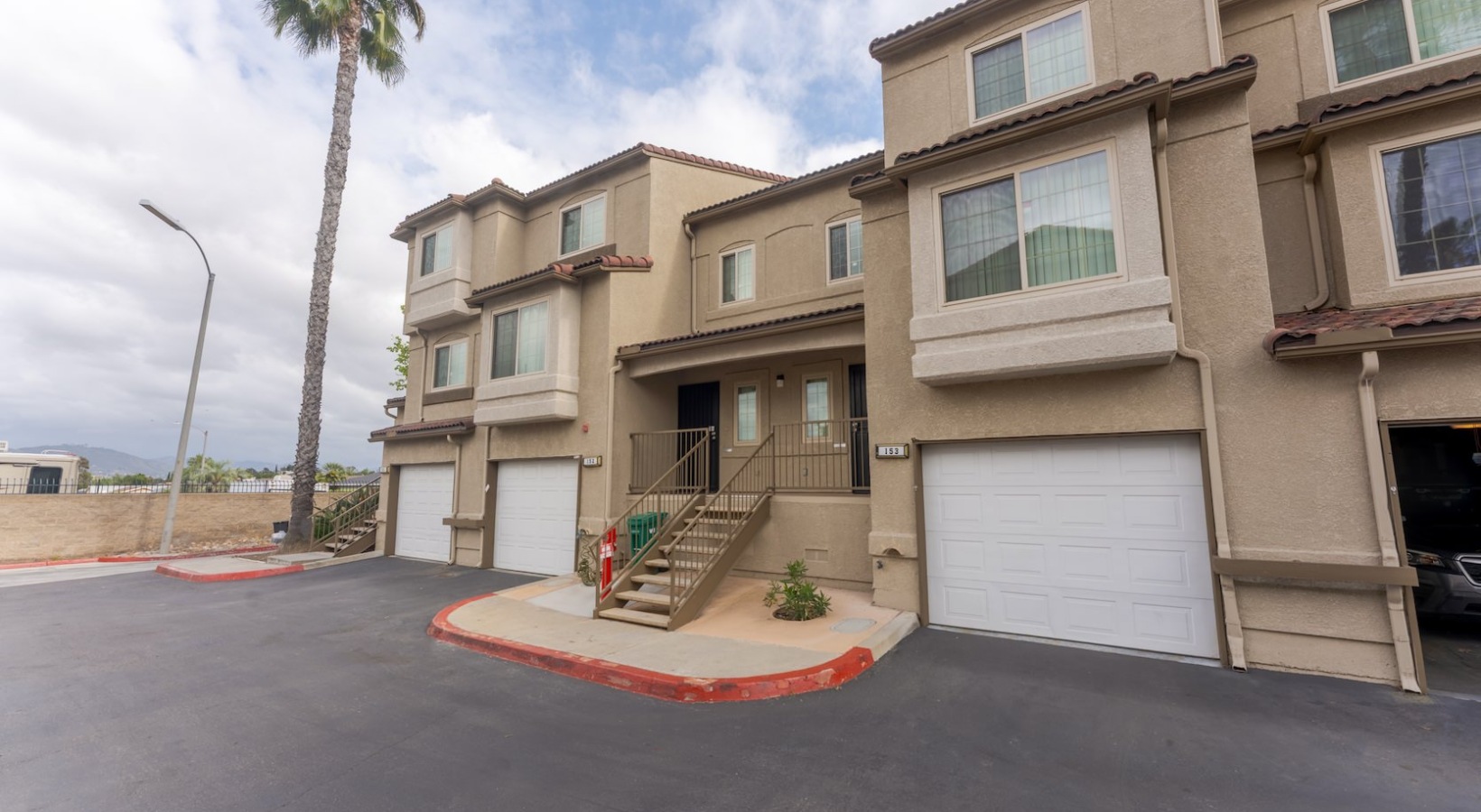 the exterior of a building with a garage