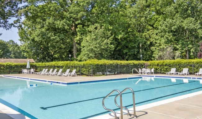 a swimming pool with a fence around it