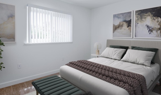 a bedroom with a bed and a couch