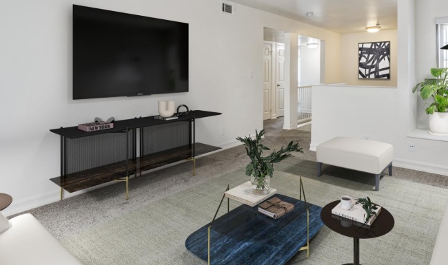 a living room with a tv and couches