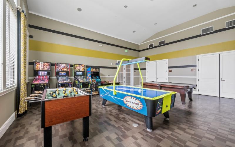 a room with a pool table and a pool table