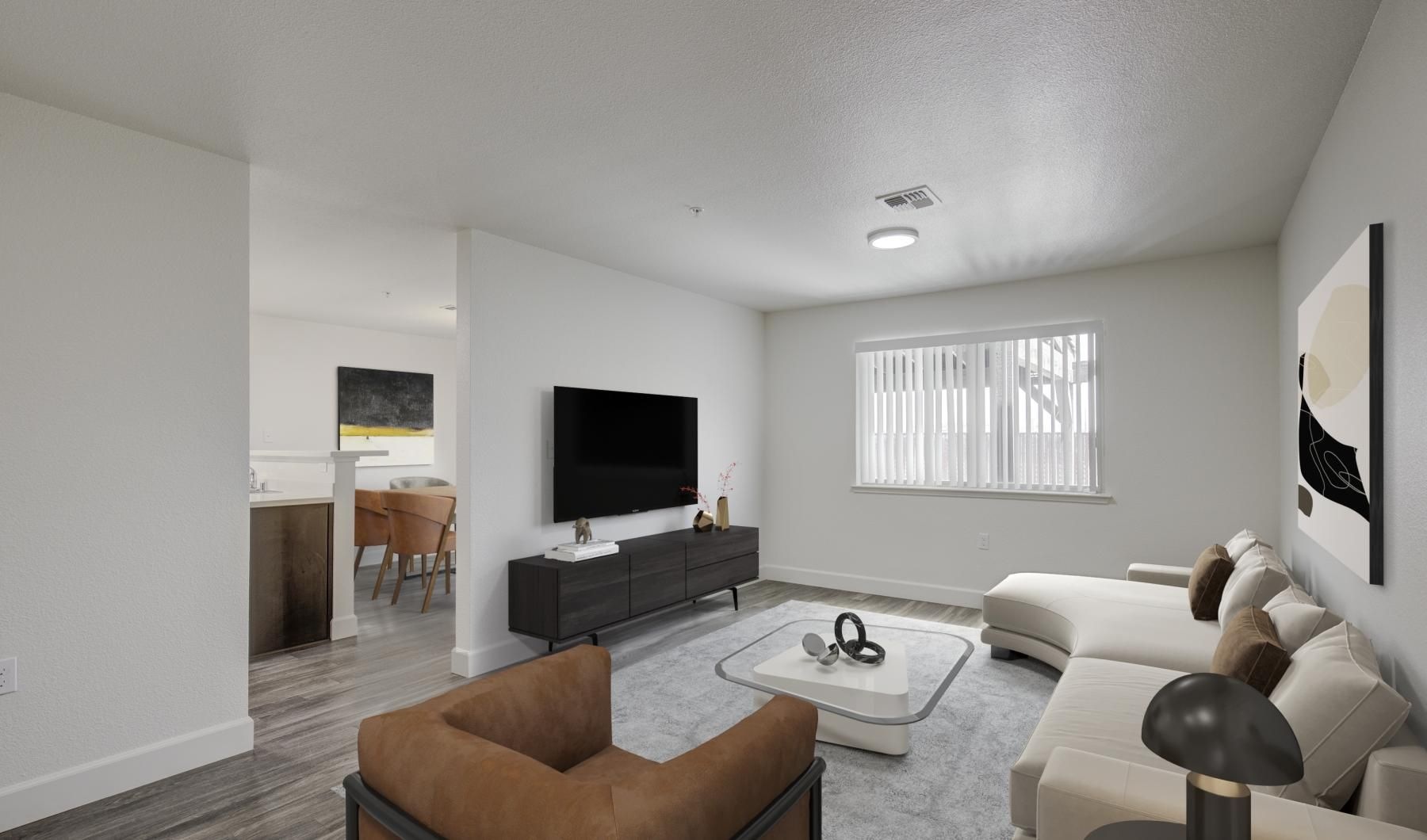 a living room with a tv and couches