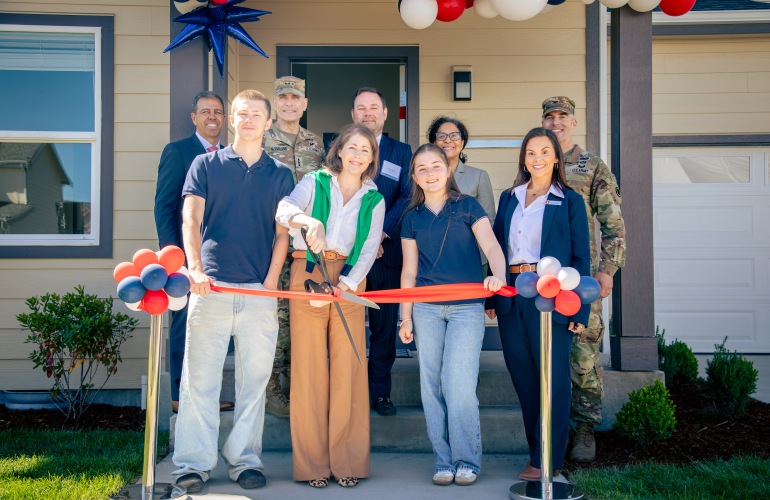 Group Smiling, About to Initiate the Ribbon Cutting 