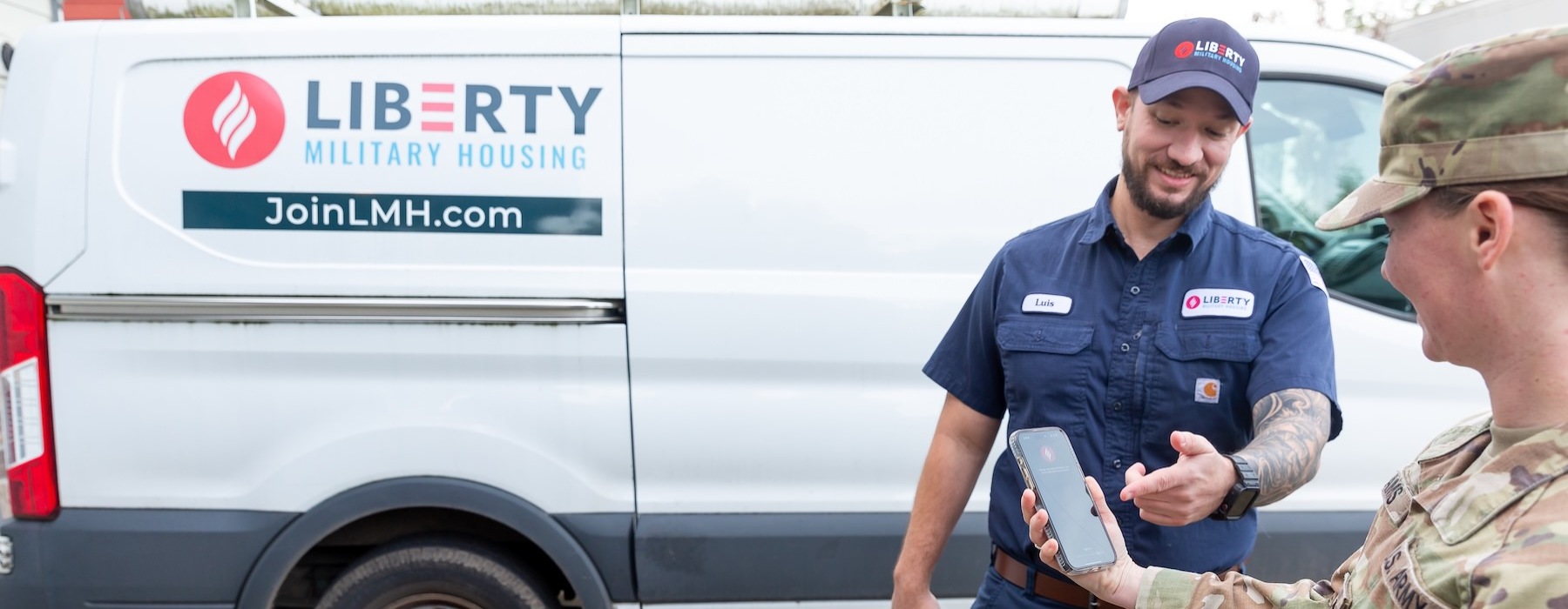 two people looking at a phone
