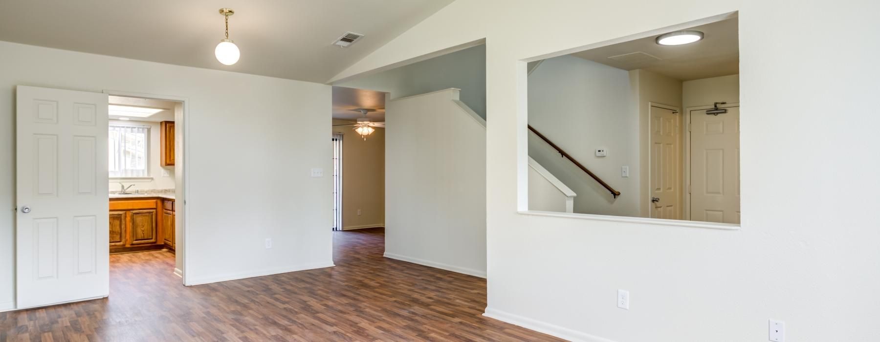 a large white room with a mirror