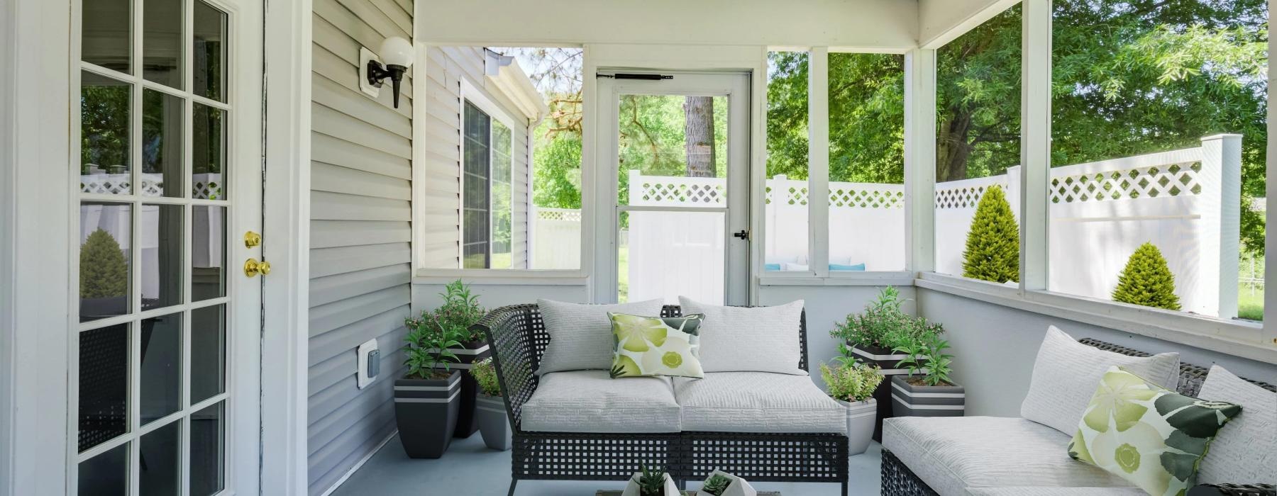 a patio with seating and a table