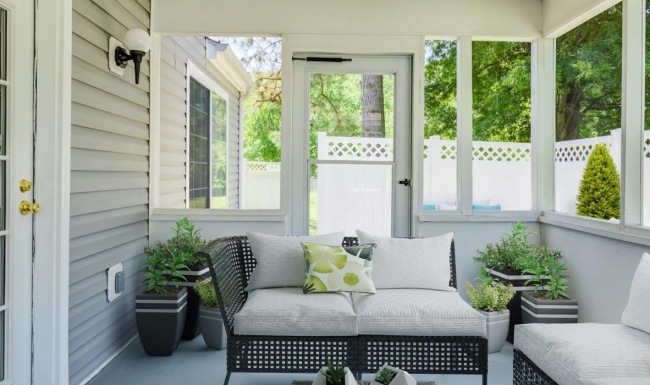 a patio with seating and a table