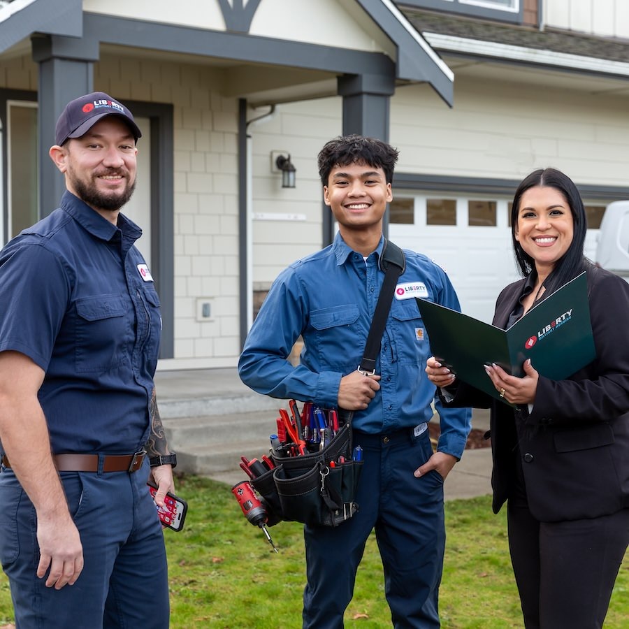 Group of people standing in front of a home