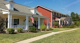 a row of houses along a sidewalk