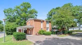 a brick house with a carport
