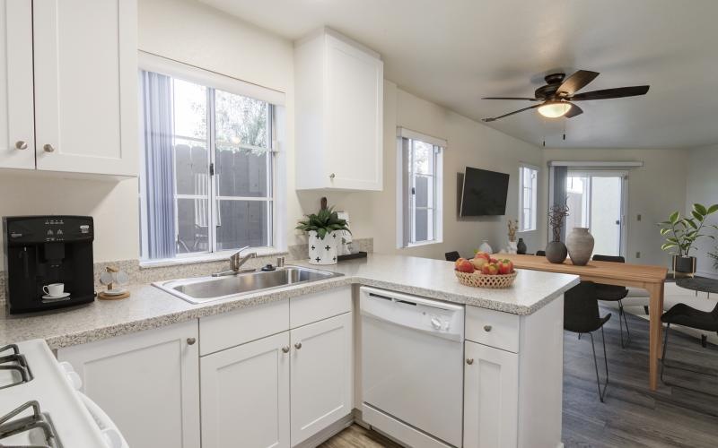a kitchen with white cabinets