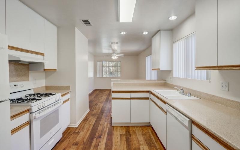 a kitchen with white cabinets