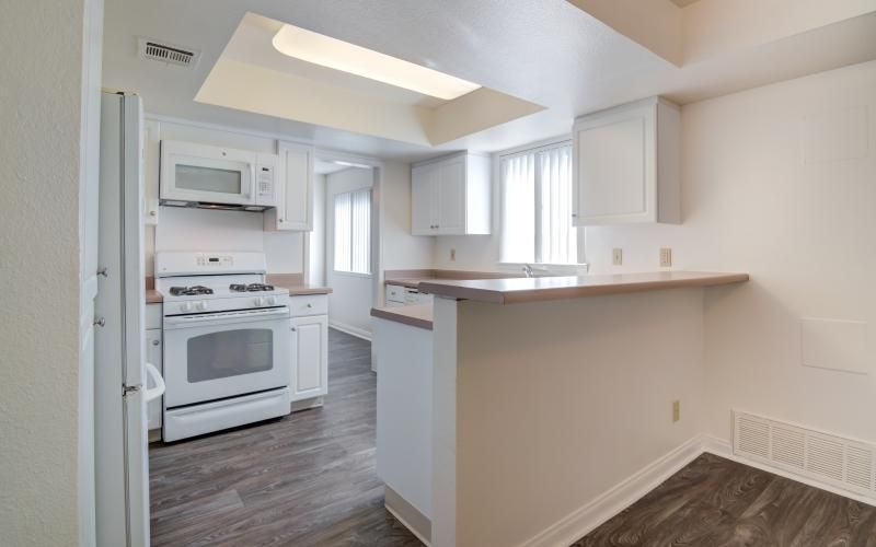 a kitchen with white appliances