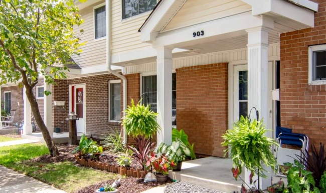 a brick building with a small garden