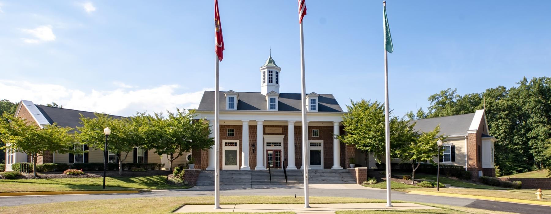 a building with flags in front of it