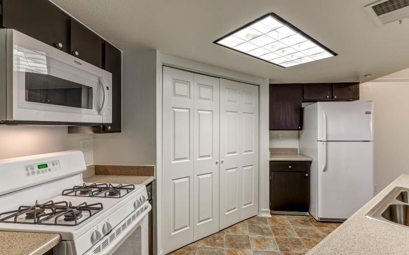 a kitchen with white cabinets