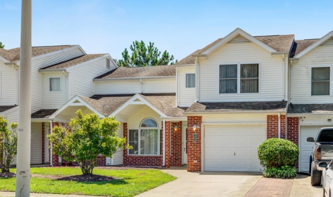 neighborhood street of homes with attached garages