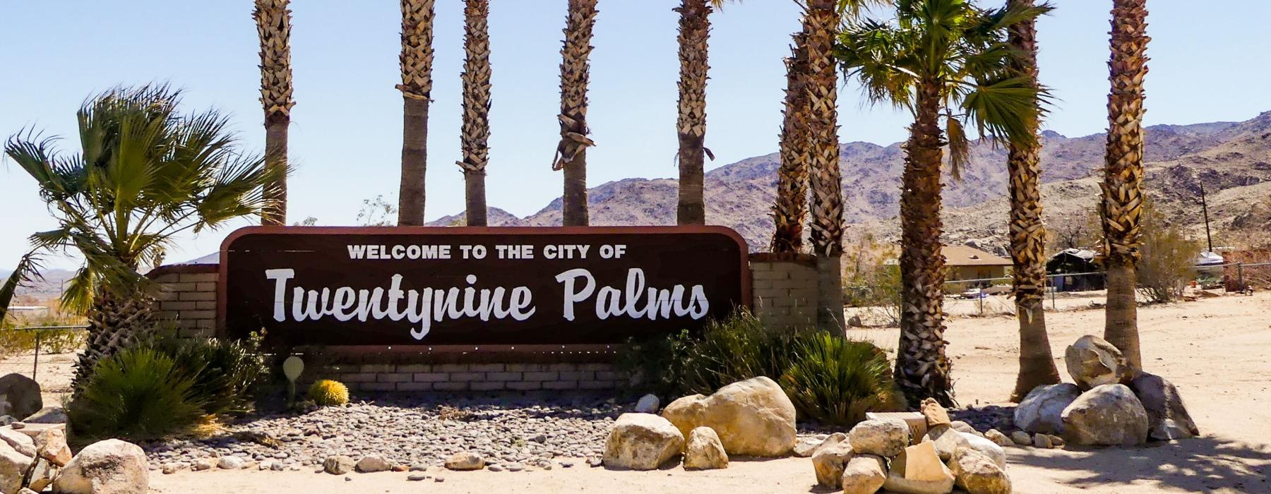 a sign in front of a beach
