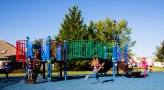 a girl running on a playground