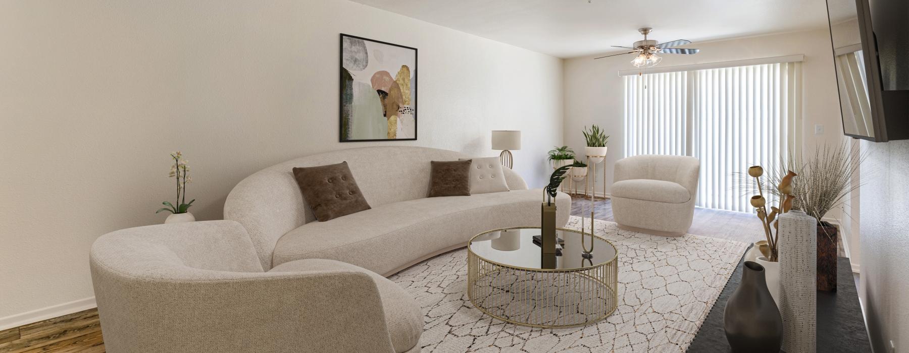 a living room with a large white couch and a coffee table