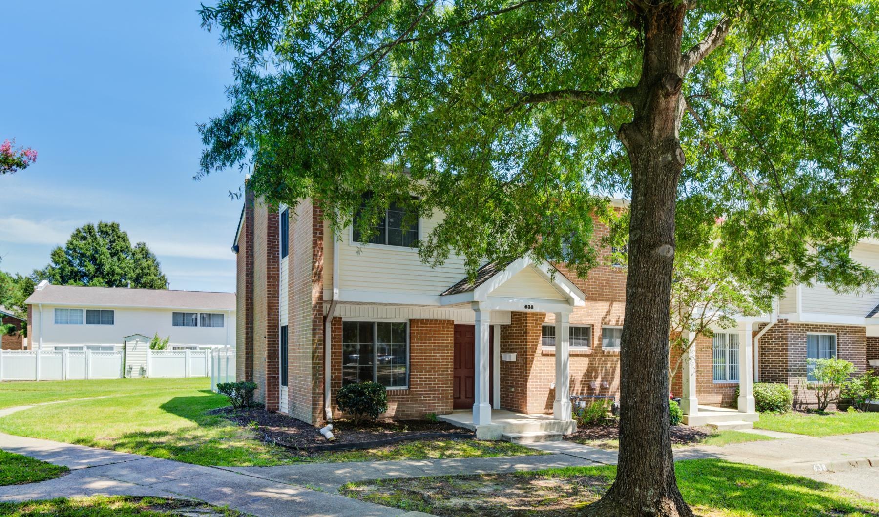 a tree in front of a building