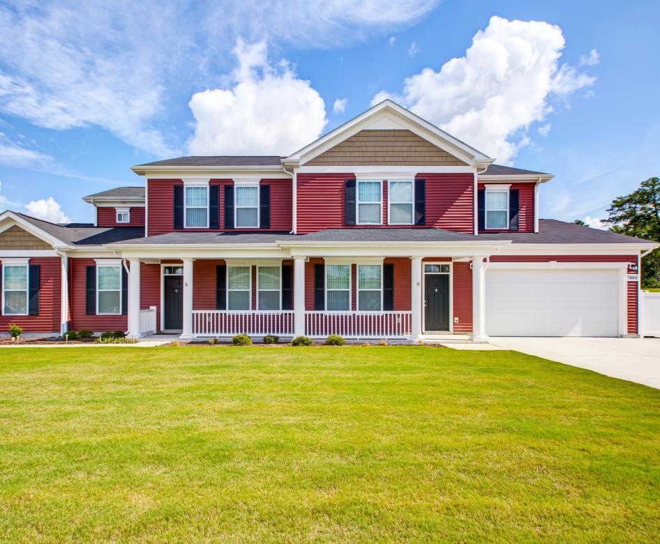 a house with a lawn in front of it