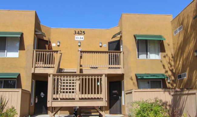 a building with a balcony and steps