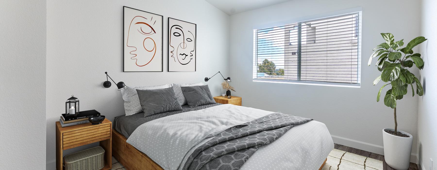 a bedroom with a bed and a plant