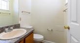 bathroom with sink mirror and toilet