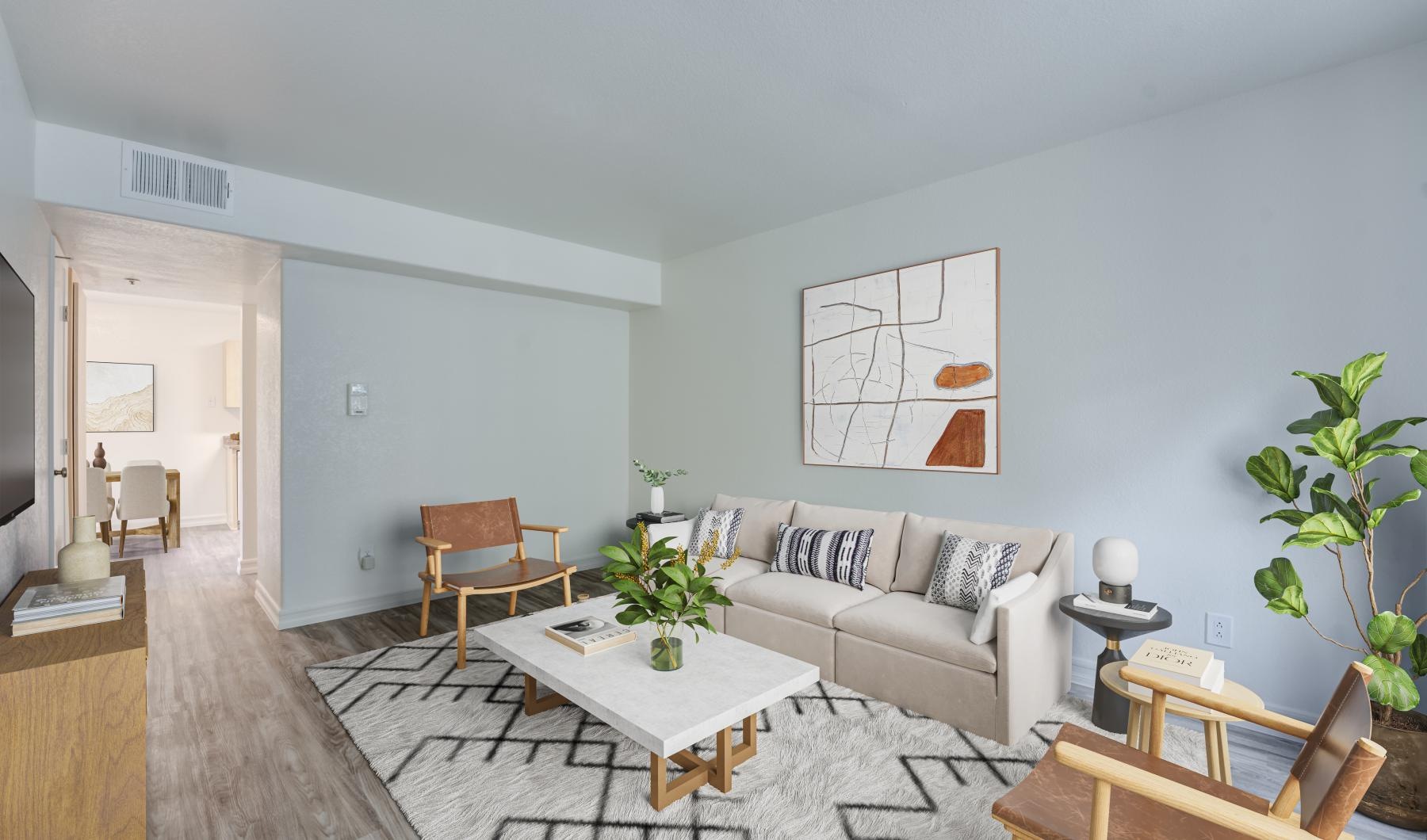 a living room with a couch and chairs