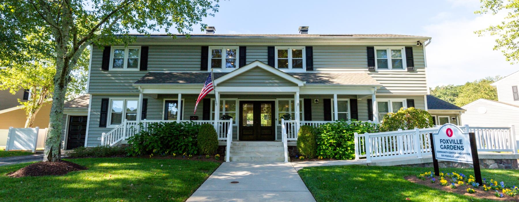 a large house with a flag on the front