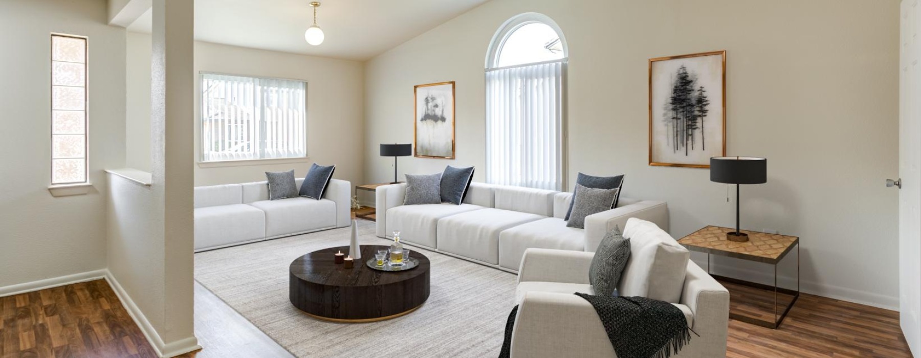 living room with white couch and love seat