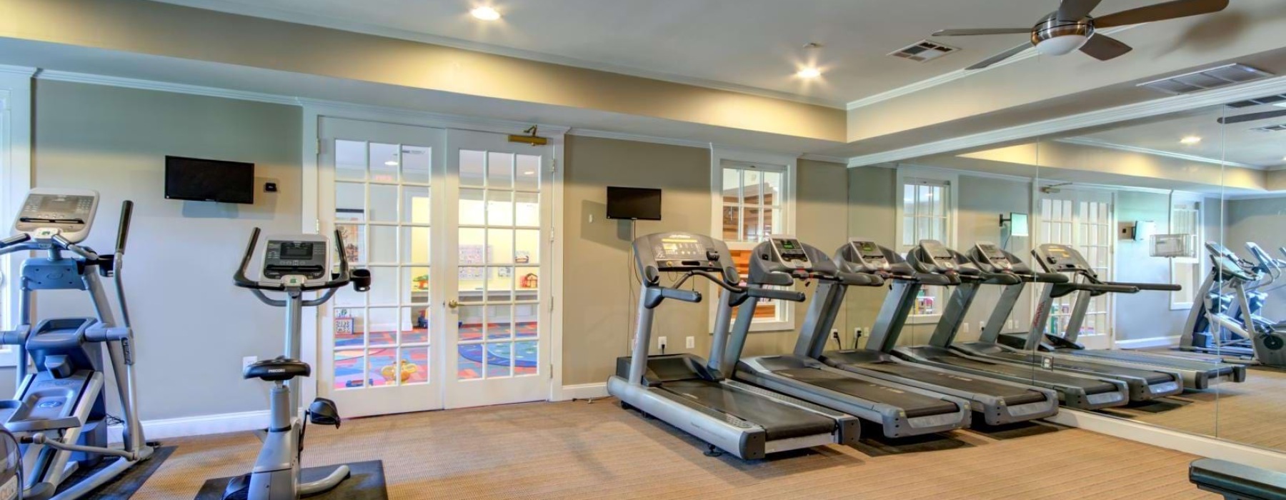 fitness center with exercise equipment