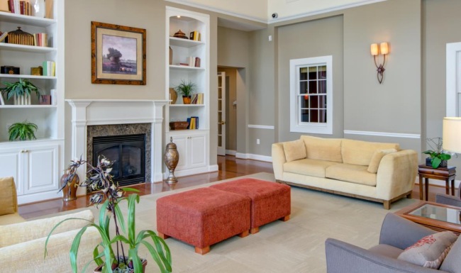 a club room with a fireplace