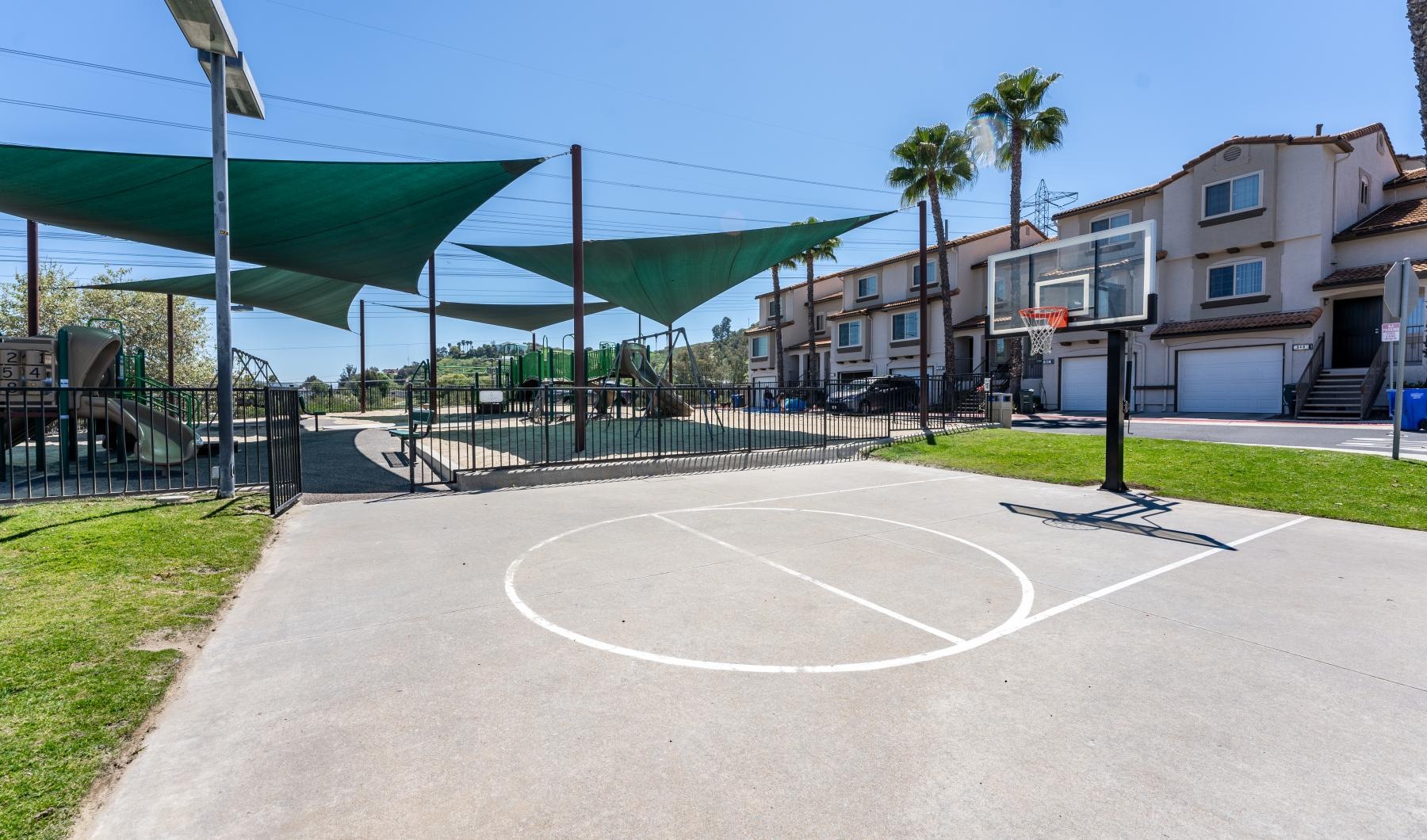 a basketball court in a neighborhood