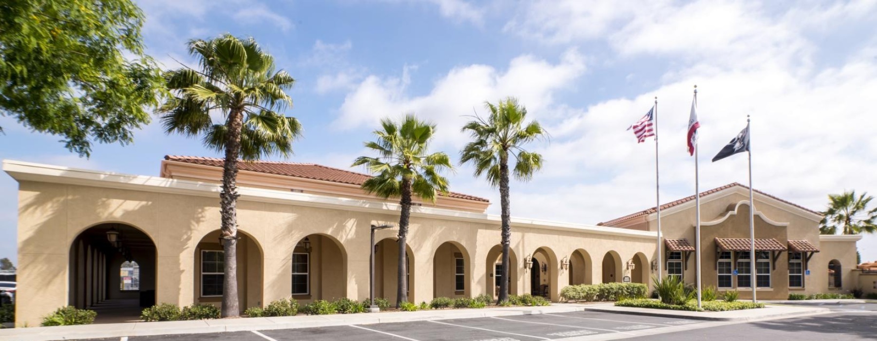 A building exterior with flags