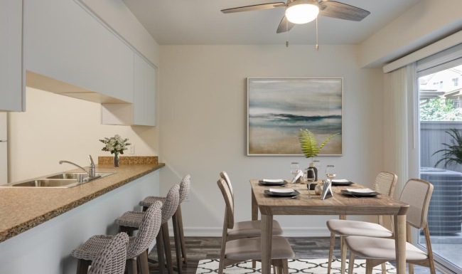 a kitchen with a table and chairs