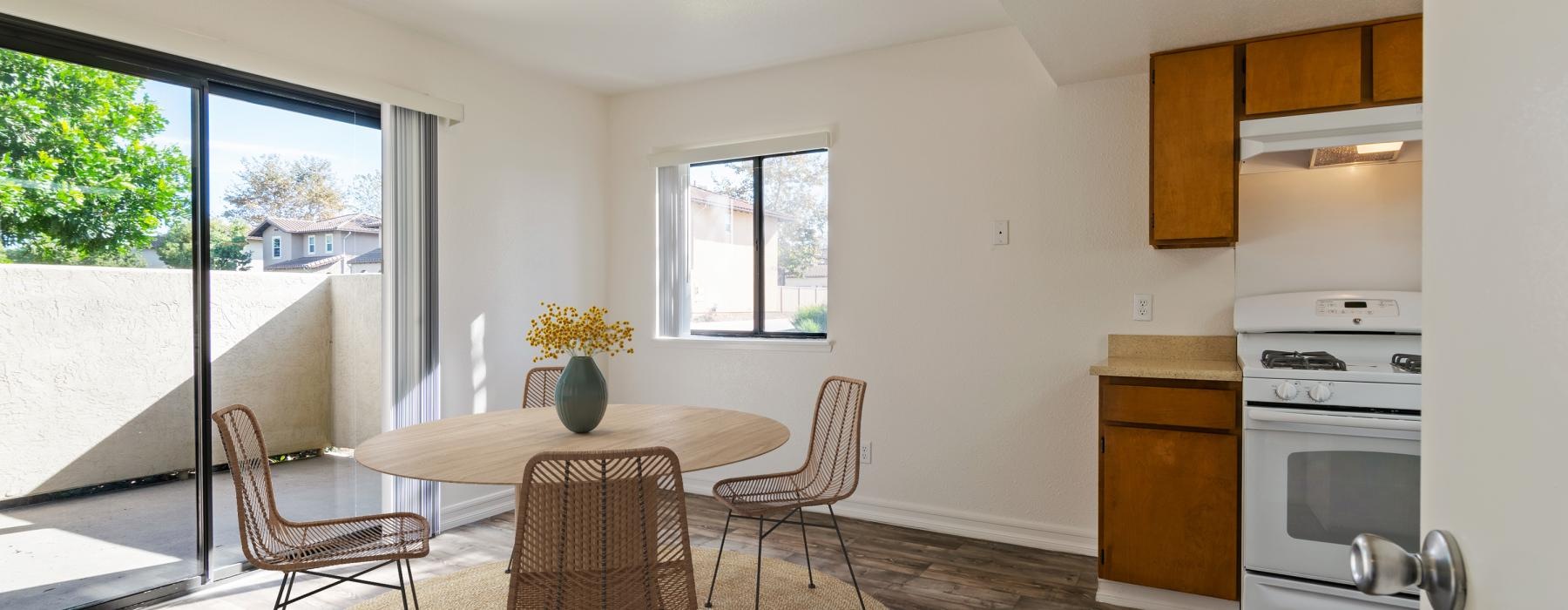 a kitchen with a table and chairs