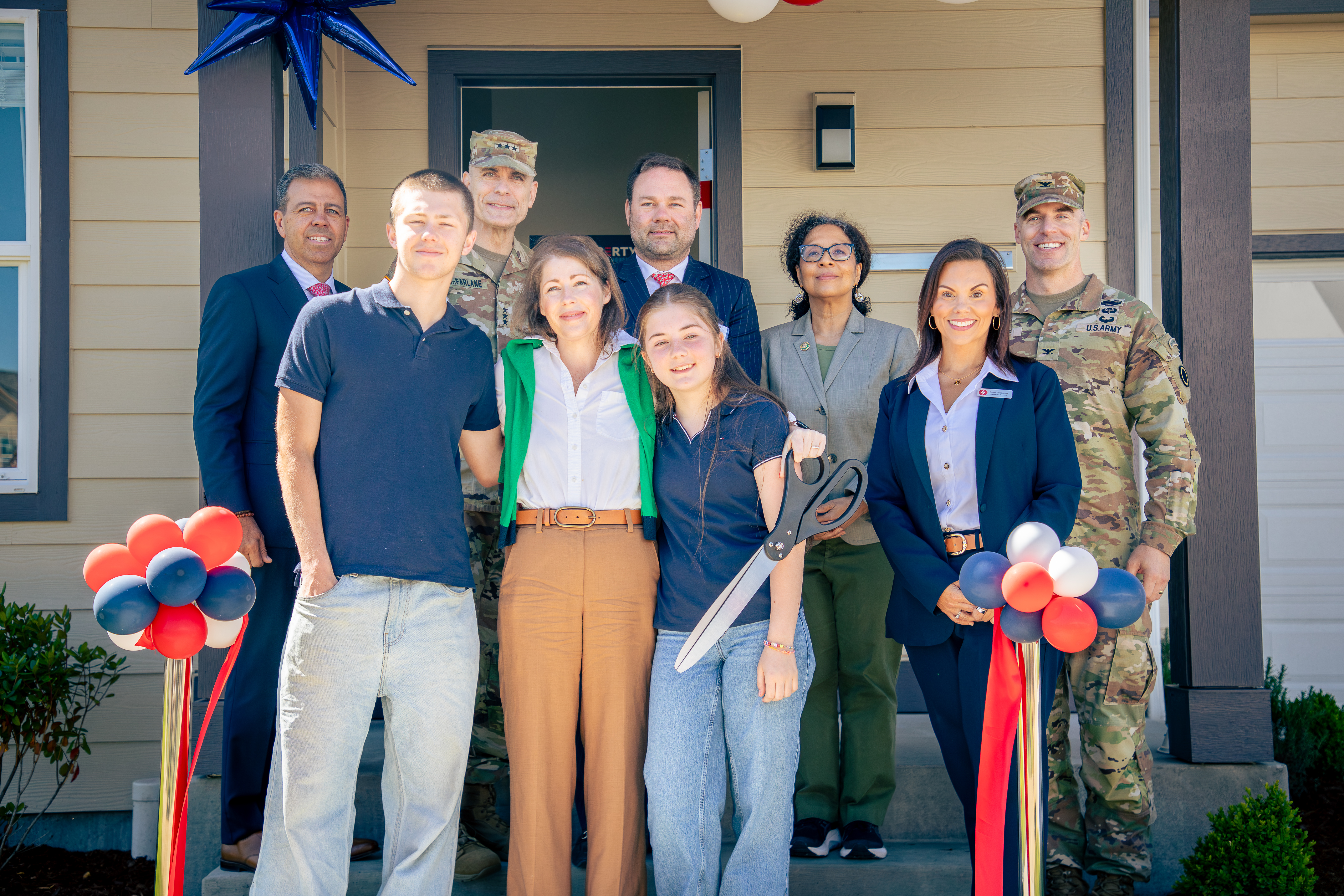 Group Smiling After Ribbon Cutting Group Smiling After Ribbon Cutting
